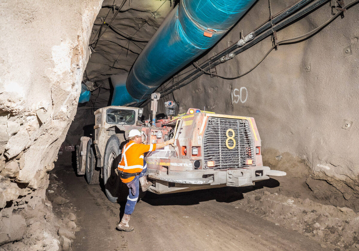 An underground miner on his load hauler